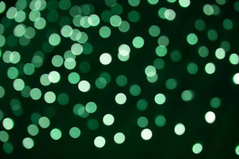 Abstract beautiful blurred background with a group of green circles from lighted Fotos Stock