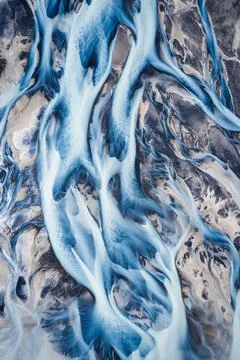 Abstract beautiful glacier rivers pattern on earth in highlands of Iceland 스톡 사진