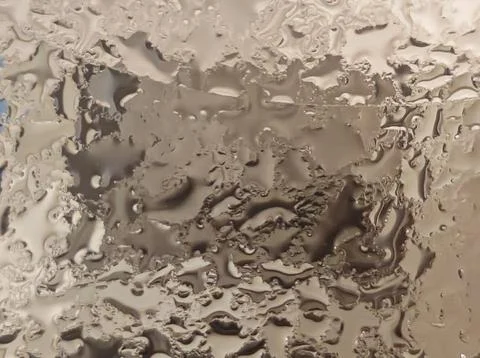 Abstract beige glossy liquid texture with soft organic surface patterns Stock Photos
