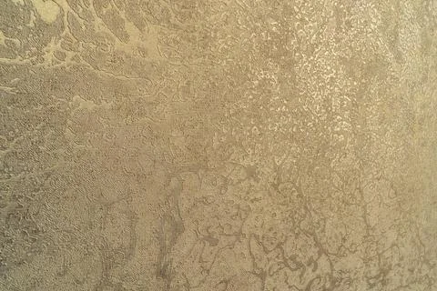Abstract beige textured wall background with decorative plaster finish Stockfoto's