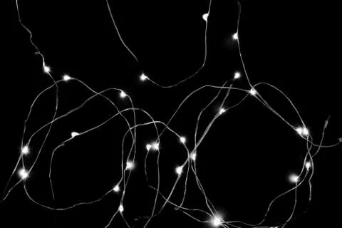 Abstract black and white background surface of illuminated garland Stock Photos