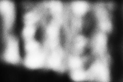 Abstract black and white blurred light texture with soft grain overlay Stock Photos