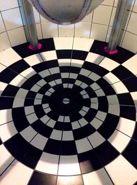 Abstract black and white checkered floor with kaleidoscopic design. Stock Photos