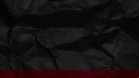 Abstract black background featuring a dark creased paper texture Stock Photos