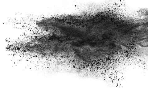 Abstract black dust explosion on white background. Stock Photos
