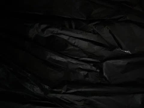 Abstract Black Fabric Texture with Deep Shadows and Subtle Highlights Stock Photos