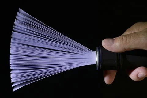 Abstract Black Flashlight and Spotlight from Book Foto stock
