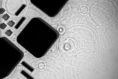 Abstract black geometric figures composition on transparent clear water Stock Photos