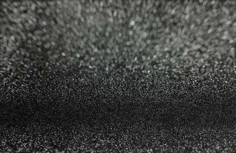 Abstract black glitter with bokeh background with selective focus, Defocused. Stock Photos