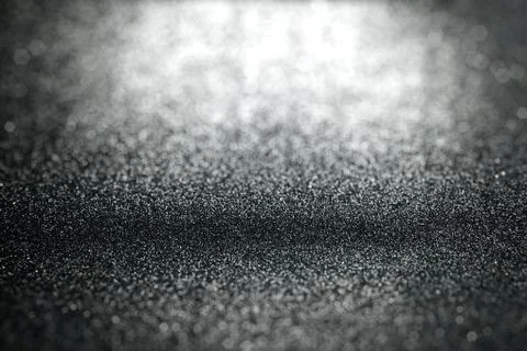Abstract black glitter lights background with surface texture focused Stock-Fotos