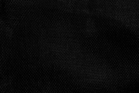 Abstract black mesh background with fine synthetic net texture Stock Photos
