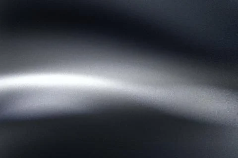 Abstract black metallic background with smooth shiny light wave reflection .. Stock Illustration