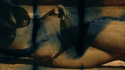 Abstract black patterns in motion. A woman in a bikini lies on the beach Video stock 125648230