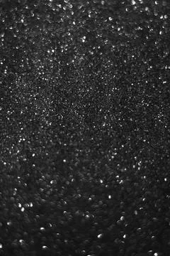 Abstract black shiny blurred background with space for text. Stock Photos