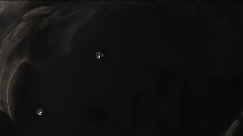 Abstract black spot on water surface, dark background with slight movement .. Stock Footage 255701093