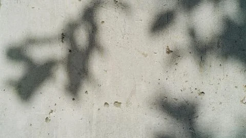 Abstract black spray paint marks on a rough concrete wall texture background Stock Photos