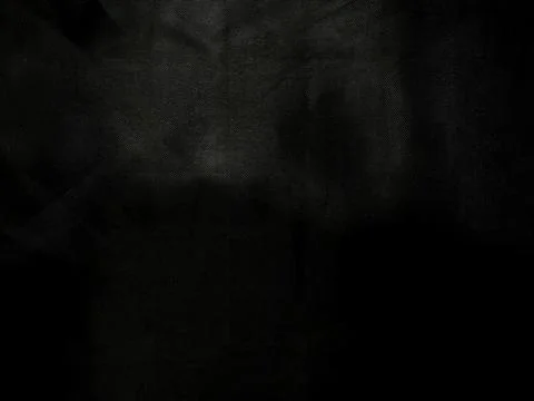 Abstract black textured surface with subtle grain and shadowy depth offering Foto stock