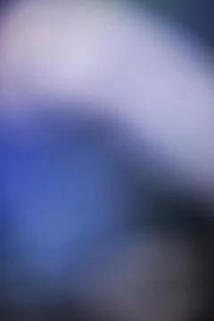 Abstract blue and purple gradient background with soft out of focus light Stock Photos