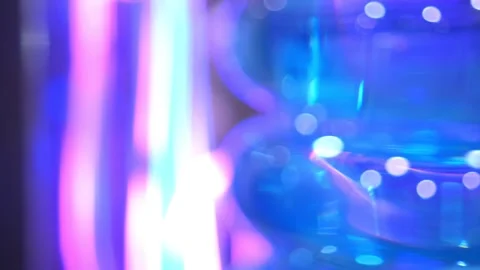 Abstract Blue and Purple Light Bokeh with Futuristic Colorful Glow creates a Stock Footage 276589990