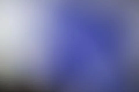 Abstract blue and white gradient background with soft light diffusion Stock Photos