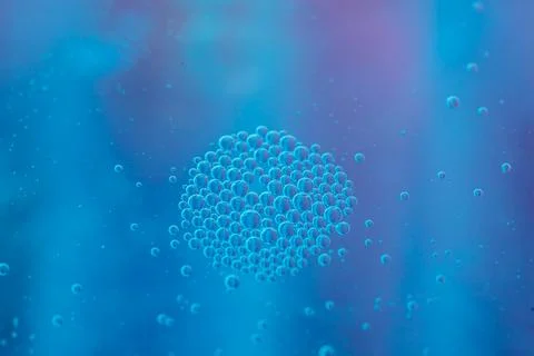 Abstract blue background with clustered bubbles.  A mesmerizing close-up of.. Stock Photos