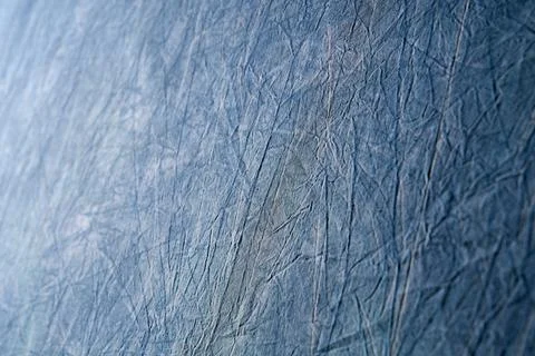 Abstract blue background design of wrinkled fabric or paper, rough texture Stock Photos