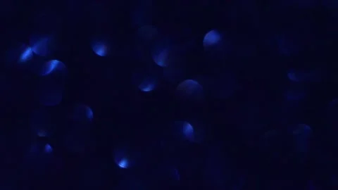Abstract blue background from shiny bokeh. Christmas backdrop. Defocus lights Stock Footage 167041950