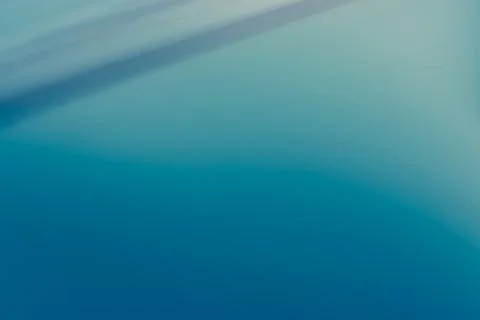 Abstract blue background with some smooth lines in it and some motion blur Stock Photos