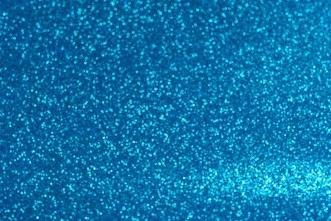 An abstract blue background with sparkle lights and bokeh. Stock Photos
