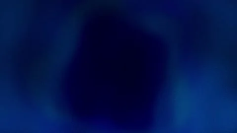 Abstract blue background with an unfolding dark spot in the center Stock Footage 206820632