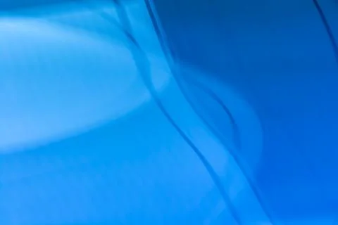 Abstract blue background with waves and gradient. Stock Photos
