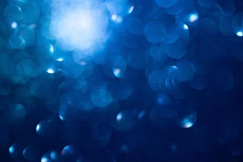 Abstract Blue Bokeh Background with Soft Focus Lights and Glittering Circles Stockfoto's