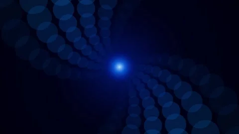Abstract Blue Bokeh Discs Spiraling Around Glowing Center Light Video stock 345592591