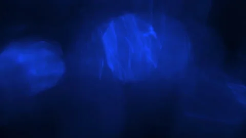 Abstract Blue Bokeh Light Leak Background With Gentle Movement On Dark Stock Footage 330197781