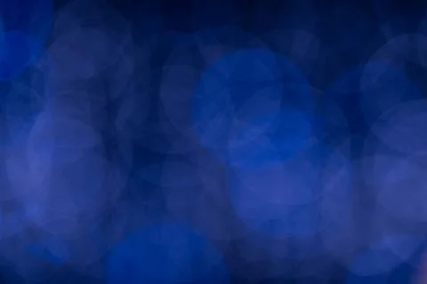Abstract blue bokeh light pattern for background design or creative visual Stock Photos
