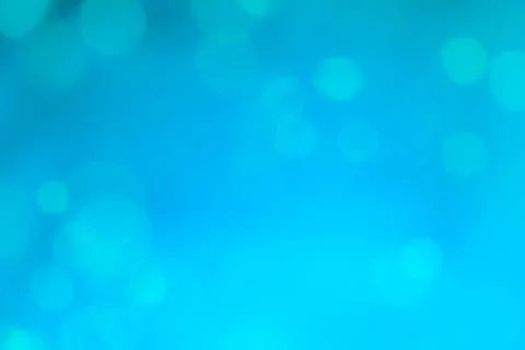 Abstract blue bokeh lights background with soft gradient and glow Stock Photos