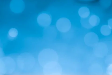 Abstract blue bokeh lights background with soft gradient and glow Stock Photos