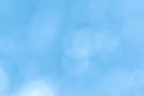 Abstract blue bokeh lights background with soft gradient and glow Stock Photos