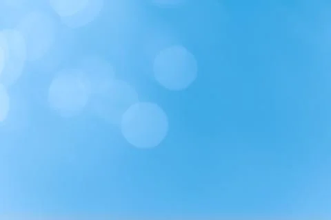 Abstract blue bokeh lights background with soft gradient and glow Stock Photos
