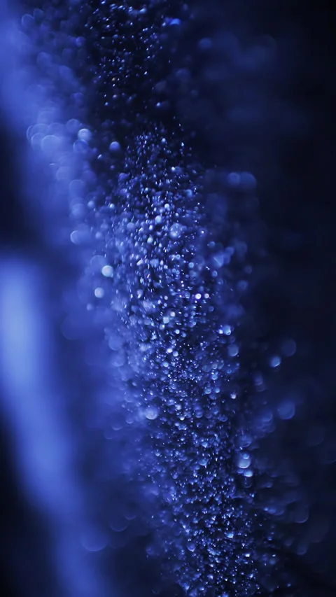 Abstract blue glittering particles in motion on black background. Vertical video Video stock 270212037