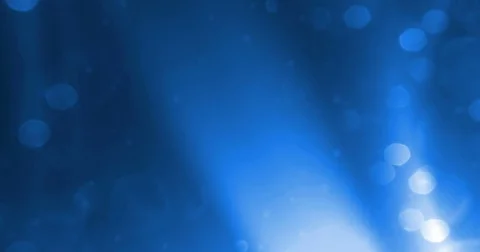 Abstract blue glow glittering particles bokeh sparkle leaks effect Stock Footage 76905180