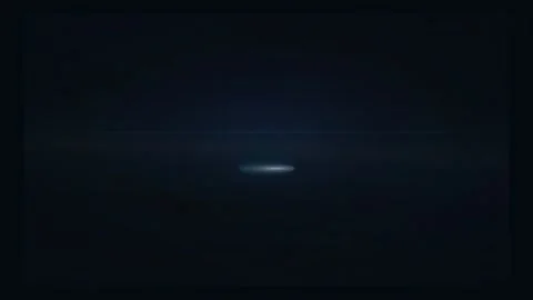Abstract blue light flare glowing and pulsing on a dark black background for Vidéo 340022789