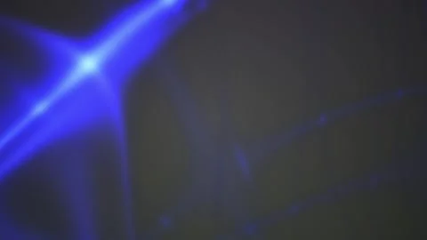 Abstract blue light flare overlay effect moving across dark background. Stock Footage 346318751
