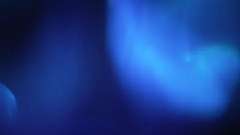Abstract blue light leak texture background against a dark backdrop. Stock Footage 342797727