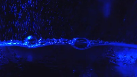 Abstract blue light motion background with particles and bubbles Stock Footage 98150256