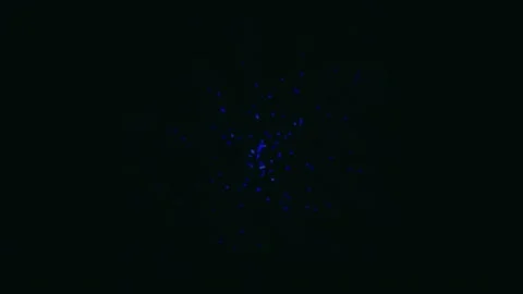 Abstract Blue Light Particles Exploding and Dissipating in Darkness. Video stock 342458804