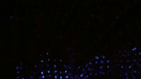 Abstract blue lights alternatively shining in the dark in a wave motion pattern Video stock 154327231