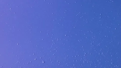 Abstract blue liquid with rising bubbles. Video stock 314834318