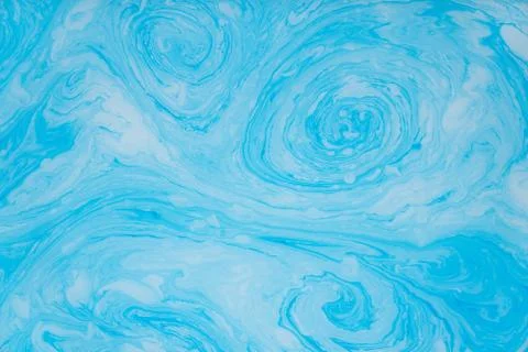 Abstract blue marble background. Stains of paint on the water. Stock Illustration