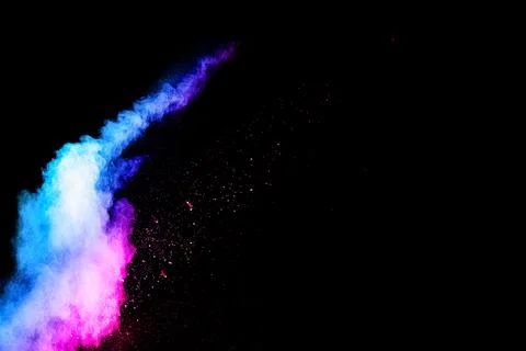 Abstract blue-pink dust explosion on black background. abstract blue-pink p.. Stock Photos